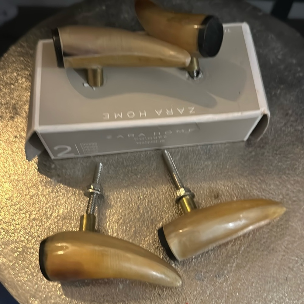 A set of 4 Zara horn shaped door knobs faux tortoise shell 2 1/2 inches.